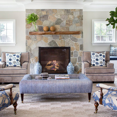 Example of a mid-sized transitional formal and enclosed living room design in New York with beige walls, a standard fireplace, a stone fireplace and no tv