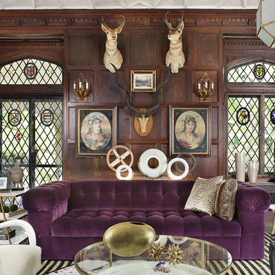 Example of an eclectic living room design in New York with brown walls