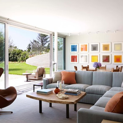 Inspiration for a large contemporary open concept and formal living room remodel in New York with white walls and a wall-mounted tv