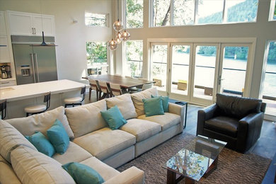Example of a large trendy open concept medium tone wood floor and brown floor living room design in Vancouver with white walls, a ribbon fireplace, a tile fireplace and a wall-mounted tv
