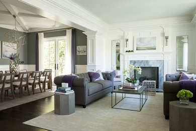 Example of a transitional living room design in Los Angeles with a standard fireplace