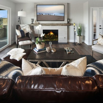 Example of a mid-sized transitional formal and open concept medium tone wood floor and brown floor living room design in Orange County with gray walls, a standard fireplace, a tile fireplace and a wall-mounted tv
