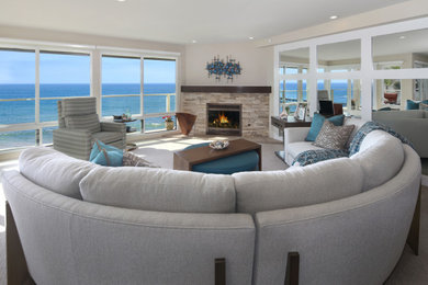 Example of a transitional open concept carpeted and beige floor living room design in Orange County with a corner fireplace, a stone fireplace and beige walls