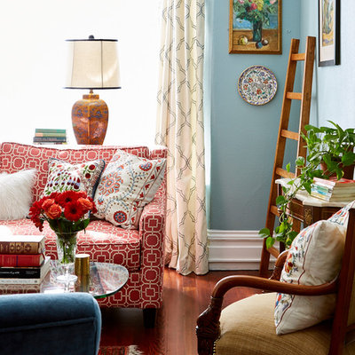 Mid-sized eclectic enclosed dark wood floor living room photo in San Francisco with blue walls, a standard fireplace, a tile fireplace and a wall-mounted tv