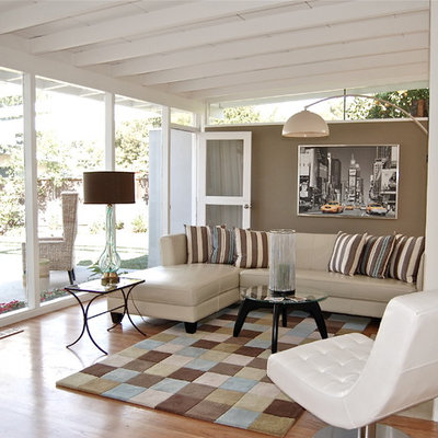 Mid-sized trendy medium tone wood floor living room photo in San Francisco