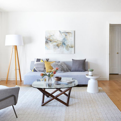 Mid-sized danish formal and enclosed light wood floor living room photo in San Francisco with white walls, no fireplace and no tv