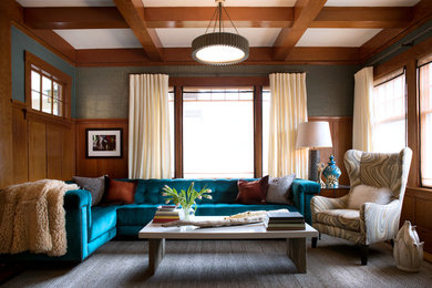 Example of a large trendy enclosed light wood floor living room design in San Francisco with blue walls, a ribbon fireplace, a stone fireplace and no tv