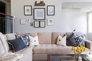 Example of a trendy open concept medium tone wood floor living room design in Seattle with beige walls