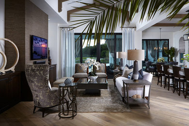 Inspiration for a large transitional open concept light wood floor living room remodel in Miami with white walls and a wall-mounted tv