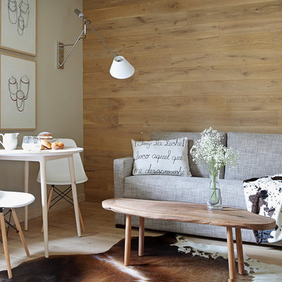 Inspiration for a mid-sized scandinavian formal and open concept light wood floor living room remodel in Other with beige walls, no fireplace and no tv