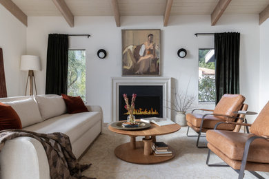 Example of a large transitional formal and enclosed beige floor and wood ceiling living room design in San Francisco with white walls, a standard fireplace, a plaster fireplace and no tv