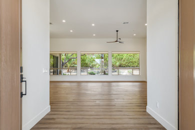 Example of a large transitional open concept vinyl floor and brown floor living room design in Phoenix