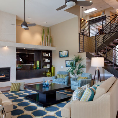 Large trendy formal and open concept medium tone wood floor and brown floor living room photo in San Diego with beige walls, a ribbon fireplace, a media wall and a stone fireplace