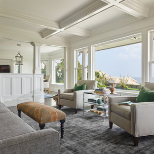 Example of a beach style dark wood floor, brown floor and coffered ceiling living room design in Boston with white walls
