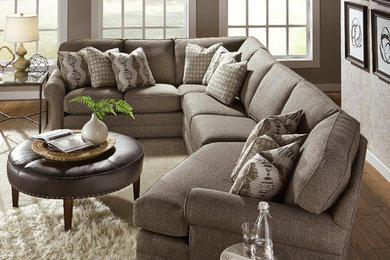 Inspiration for a mid-sized transitional enclosed medium tone wood floor living room remodel in Detroit with gray walls