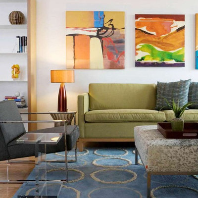 Inspiration for an eclectic living room remodel in DC Metro with white walls