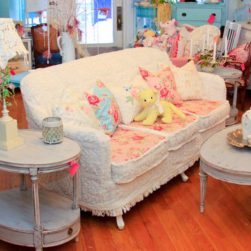 shabby chic sofa slipcovered with vintage chenille bedspreads and roses fabrics