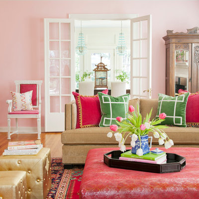 Inspiration for a transitional living room remodel in Other with pink walls