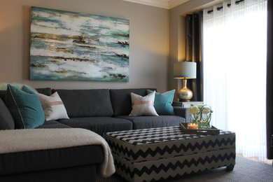 Inspiration for an eclectic medium tone wood floor and beige floor living room remodel in Toronto with beige walls