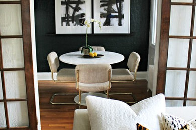 Living room - eclectic light wood floor living room idea in DC Metro with black walls