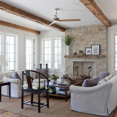 Inspiration for a coastal living room remodel in New York with a stone fireplace