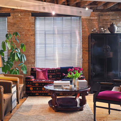 Living room - mid-sized industrial open concept medium tone wood floor living room idea in London with multicolored walls