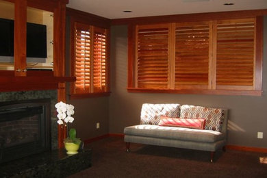 Example of an enclosed living room design in Seattle with gray walls