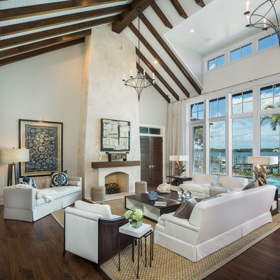 Inspiration for a huge contemporary open concept and formal dark wood floor living room remodel in Tampa with beige walls, a standard fireplace, a stone fireplace and no tv