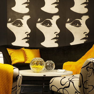 Inspiration for an eclectic living room remodel in Los Angeles with black walls
