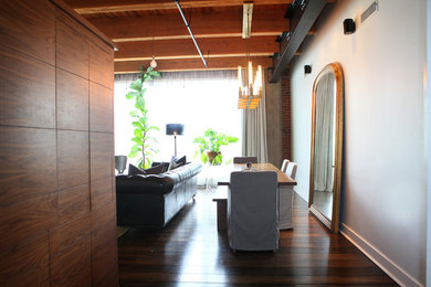 Inspiration for a transitional dark wood floor and brown floor living room remodel in Indianapolis with white walls