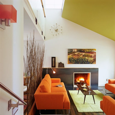 Minimalist dark wood floor living room photo in DC Metro with white walls and a standard fireplace