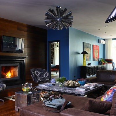 Inspiration for an eclectic living room remodel in Moscow with a standard fireplace