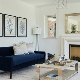 Design ideas for a beach style formal living room in Sussex with white walls, a standard fireplace and no tv.