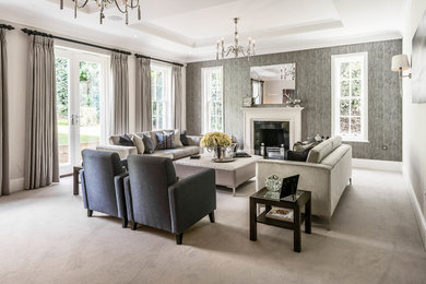 Photo of a traditional formal living room in Surrey with grey walls, carpet and a standard fireplace.