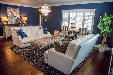 Inspiration for a mid-sized coastal formal and enclosed medium tone wood floor and brown floor living room remodel in Tampa with blue walls, no fireplace and no tv