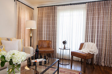На фото: парадная, изолированная гостиная комната среднего размера в классическом стиле с белыми стенами, темным паркетным полом и коричневым полом без камина, телевизора