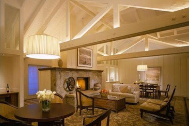Example of a large classic formal and open concept carpeted living room design with white walls, a standard fireplace and a stone fireplace