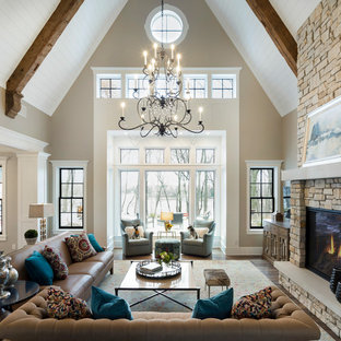 Elegant open concept dark wood floor living room photo in Minneapolis with beige walls, a standard fireplace and a stone fireplace