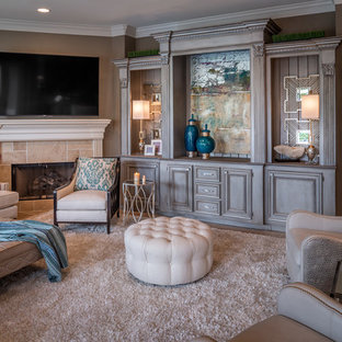 Inspiration for a large transitional open concept travertine floor and beige floor living room remodel in Houston with brown walls, a standard fireplace, a stone fireplace and a wall-mounted tv