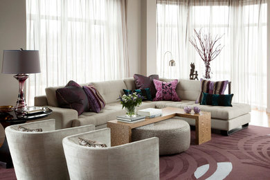 Example of a large trendy open concept carpeted living room design in Boston with gray walls