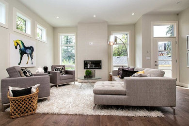 Mid-sized transitional open concept medium tone wood floor living room photo in Calgary with a ribbon fireplace, a tile fireplace, gray walls and no tv