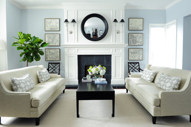 Example of a classic formal living room design in Vancouver with blue walls and a standard fireplace