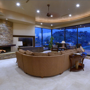 Living room - southwestern living room idea in Phoenix with a stone fireplace