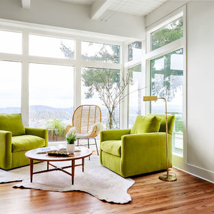 Living room - small contemporary open concept and formal medium tone wood floor and brown floor living room idea in Portland with white walls