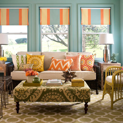 Example of a mid-sized eclectic enclosed carpeted and multicolored floor living room design in Jacksonville with blue walls, no fireplace and no tv