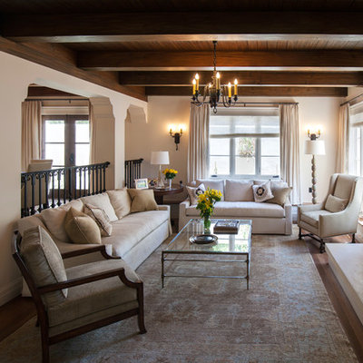 Mid-sized tuscan open concept dark wood floor living room photo in Santa Barbara with white walls, a standard fireplace and a stone fireplace