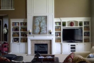 Example of a large formal and open concept living room design in Detroit with a media wall