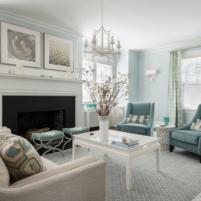Example of a classic formal living room design in Providence with blue walls and a standard fireplace