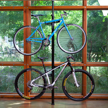 Spring loaded column holds 2 bikes (4 bikes with optional add-on).