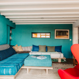 Inspiration for a medium sized beach style enclosed living room in Cornwall with blue walls, dark hardwood flooring, brown floors and exposed beams.